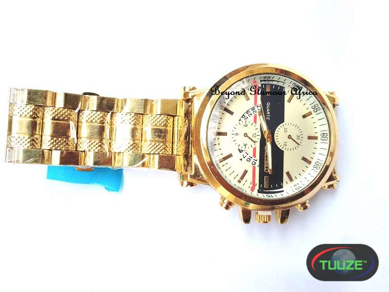 Gold tone luxury watch with white face